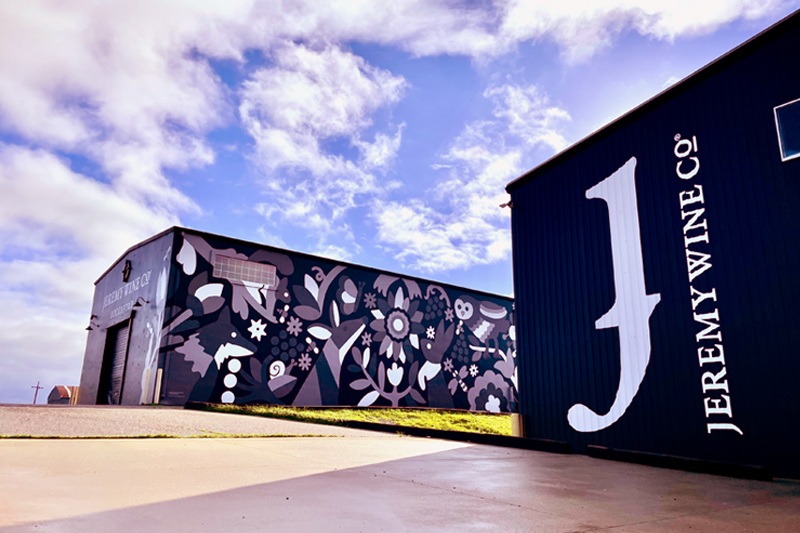 Lockeford winery building with a large J mural