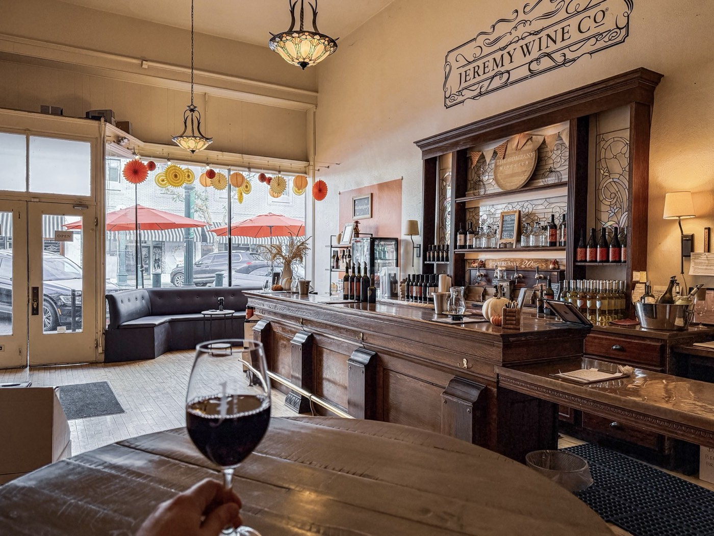 The downtown Lodi tasting room bar, with a glass of red in the foreground