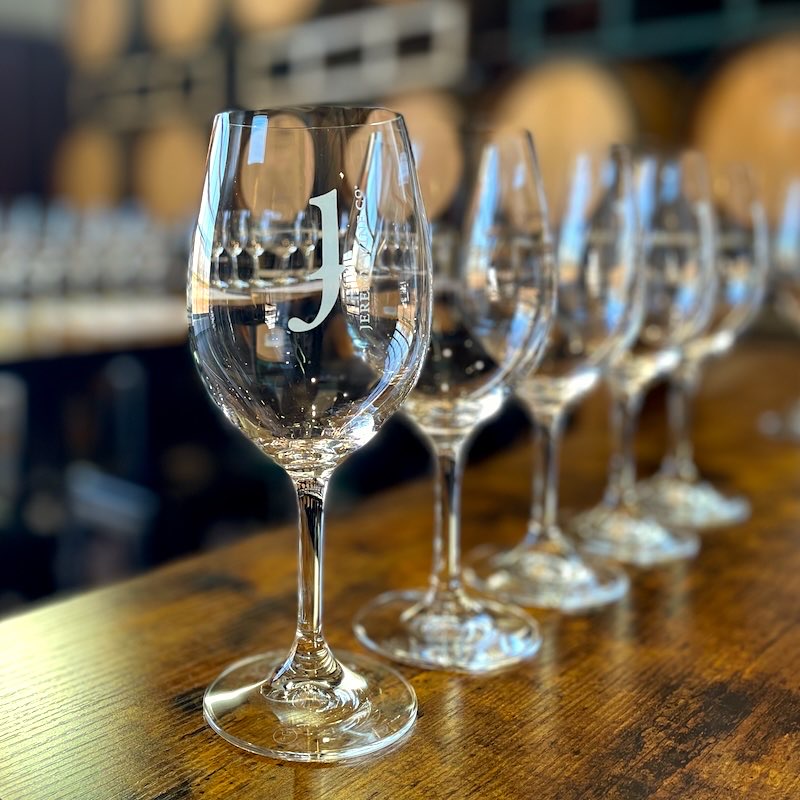 Glasses of barrel samples lined up on the Zin Lab blending table